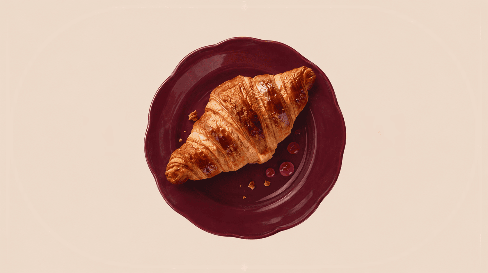 Elegant croissant on a scalloped plate