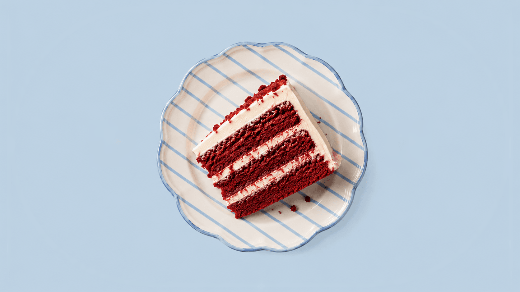 Red velvet cake slice on a delicate plate